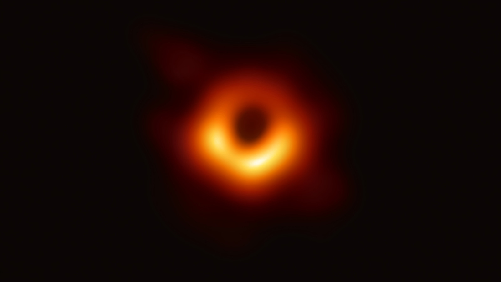 Before enhancement: blurred black hole image with faint glowing ring